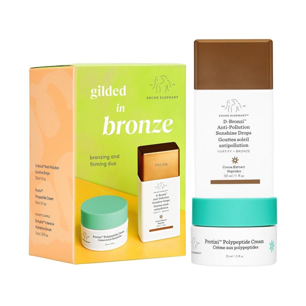 imageDrunk Elephant Gilded in Bronze Kit  Includes DBronzi AntiPollution Sunshine Drops 30 ml1 fl oz ampamp Protini Polypeptide Cream 15 ml05 fl oz  Holiday Gift Set